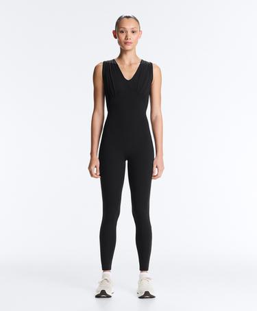 OYSHO Длинный комбинезон LIGHT TOUCH с V-образным вырезом купить с доставкой.