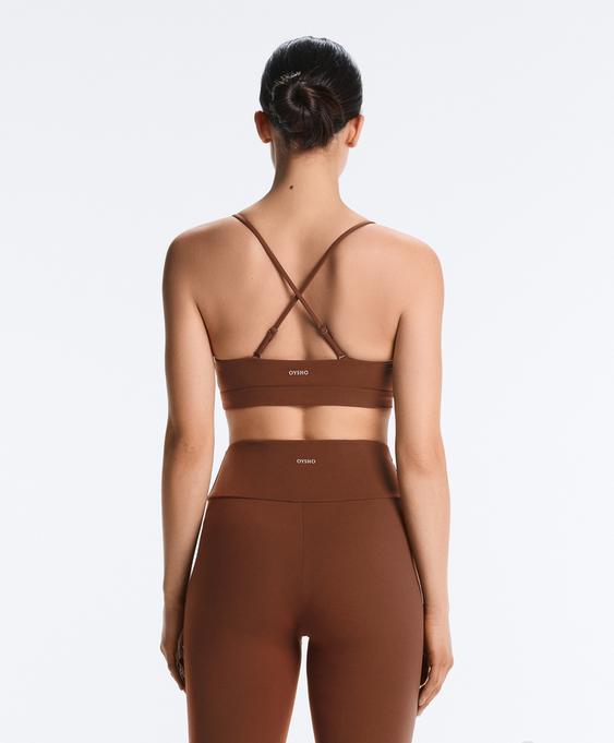 OYSHO Спортивный топ с перекрещивающимися лямками COMFORTLUX с легкой поддержкой