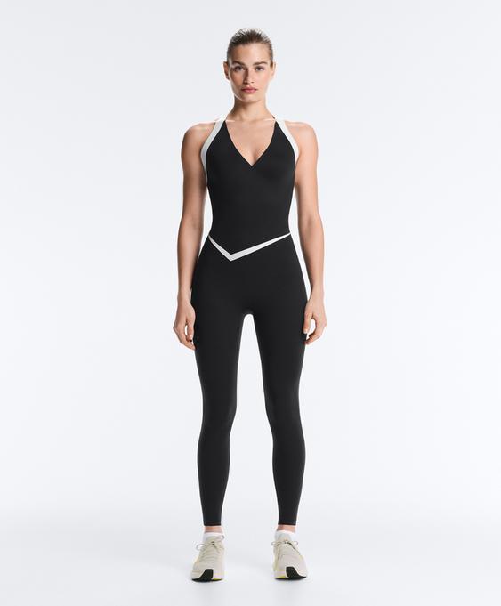 OYSHO Длинный комбинезон PERFECT-ADAPT без рукавов с контрастными деталями купить с доставкой.