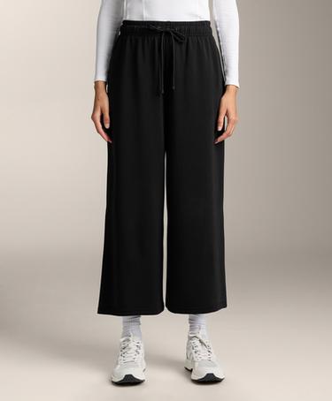 OYSHO Широкие укороченные брюки из мягкой ткани с модалом купить с доставкой.