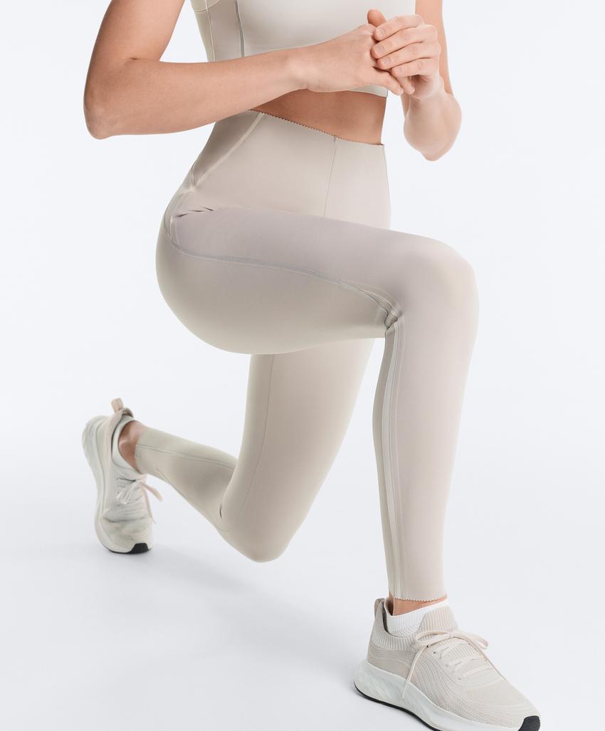 Леггинсы с высокой посадкой и компрессией для контроля фигуры с отражающими элементами на щиколотке