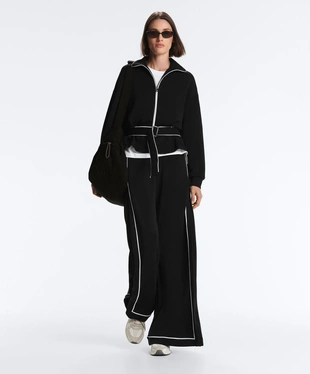 Широкие брюки из мягкого модала с контрастной окантовкой- Заказать в России