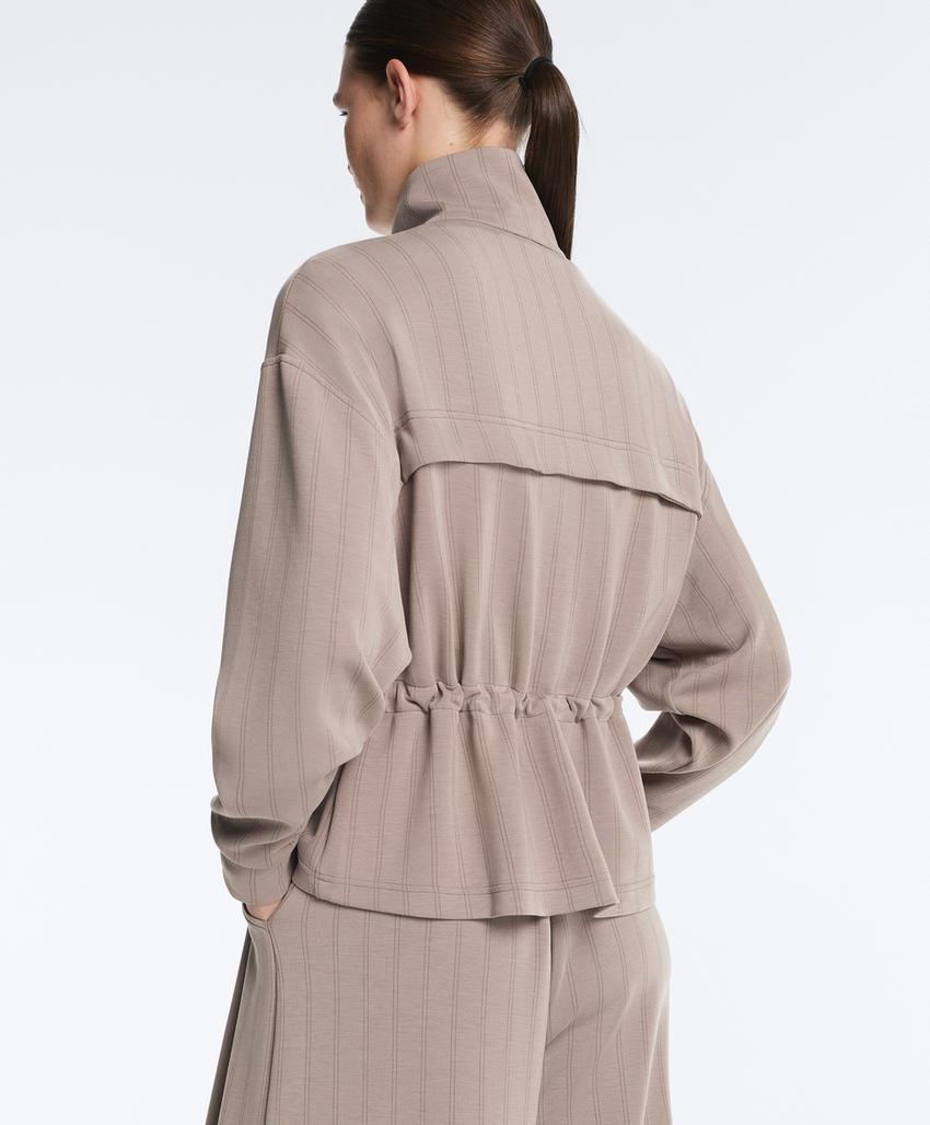 Soft-touch modal jacket with adjustable waist and high collar