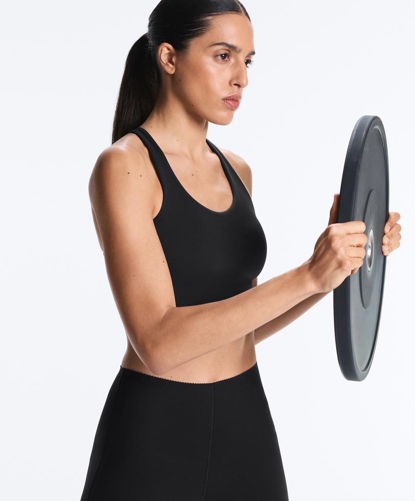 Compressive cross-back sports bra with firm support