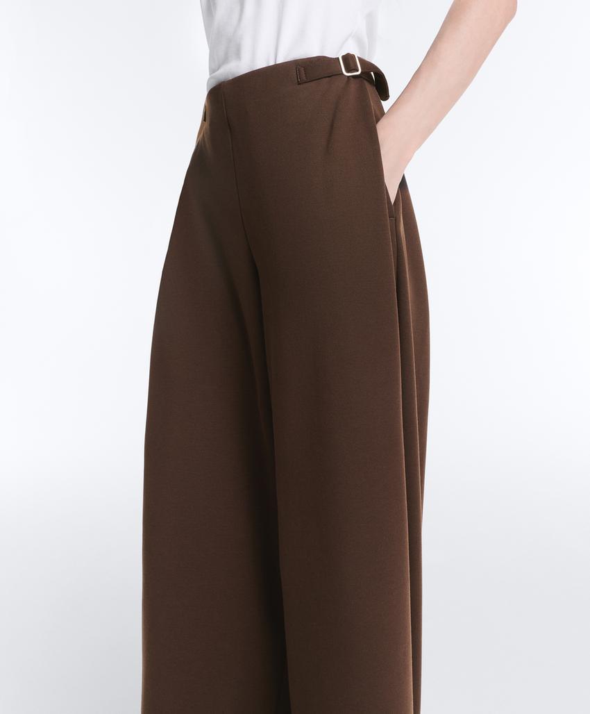 Широкие брюки-пике  с пряжками