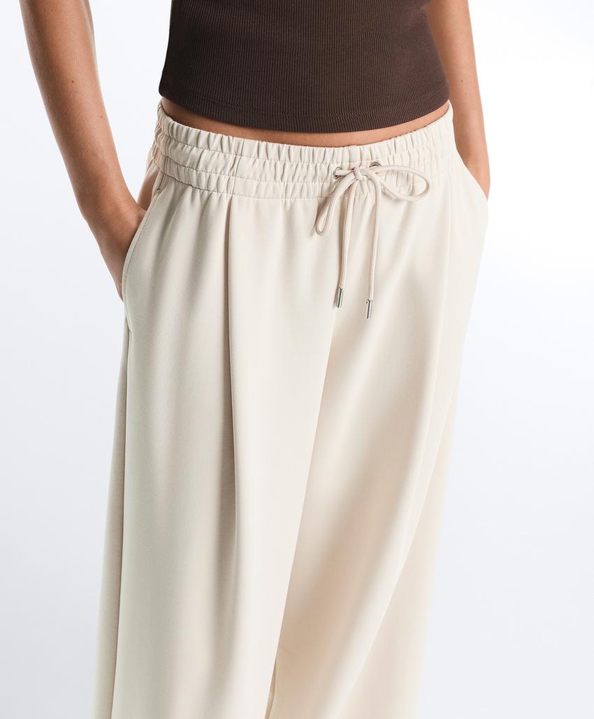 Широкие брюки пике со складками и хлопком