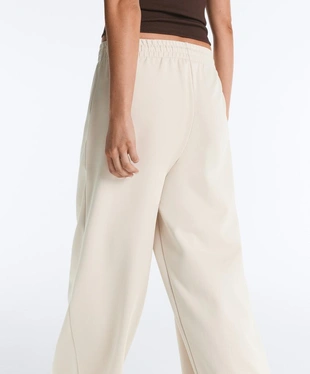 Широкие брюки пике со складками и хлопком- Заказать в России