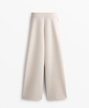 Брюки из ткани с эффектом неопрена, слегка расклешенные внизу- Заказать в России