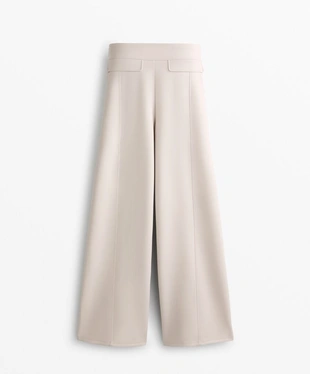 Брюки из ткани с эффектом неопрена, слегка расклешенные внизу- Заказать в России