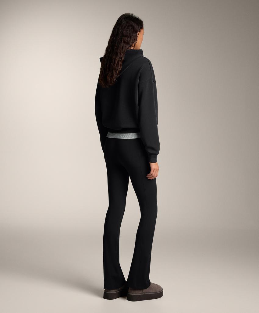 Теплые брюки клеш с высокой посадкой и карманами