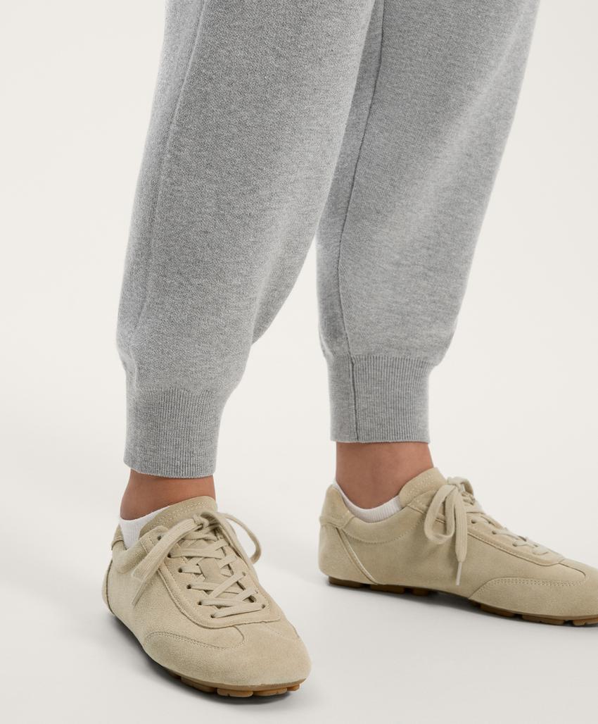 Длинный вязаный комбинезон с молнией до середины груди